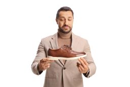 Man looking at shoe