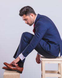 Man looking at his shoe